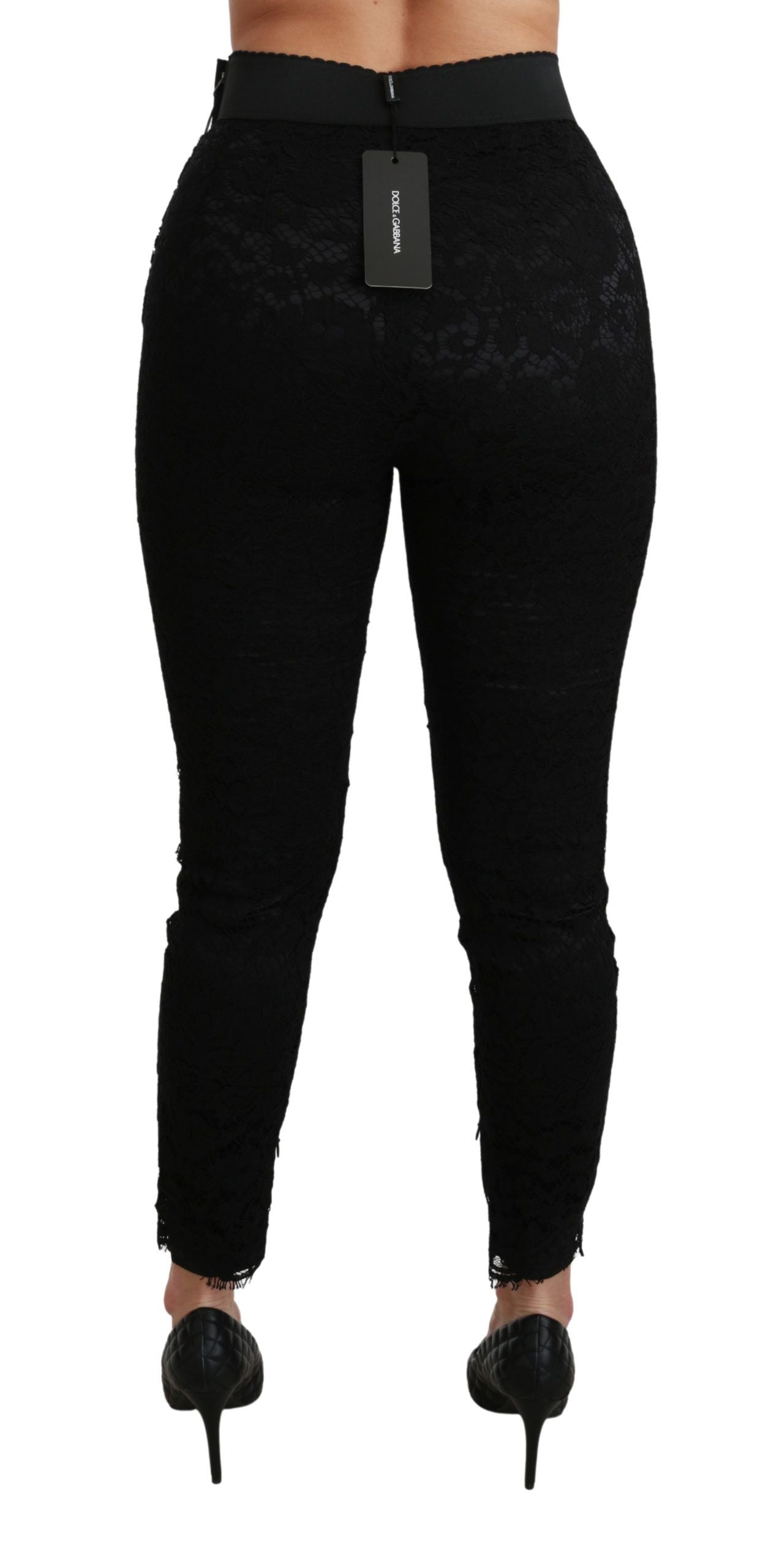 Pantalons en coton noir à taille haute et dentelle, style skinny, de la marque Dolce & Gabbana, visibles sur l'image.