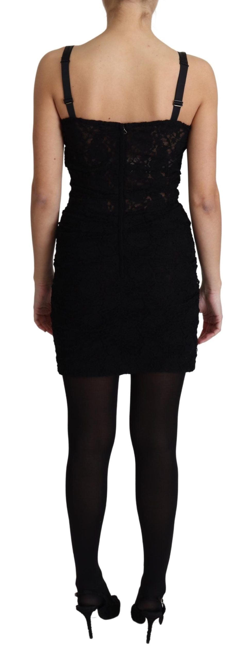 Robe courte Dolce & Gabbana en dentelle noire avec corset floral, bustier et lacets, élégante et ajustée.