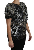 Haut en sequins noirs Dolce & Gabbana avec cristaux ornementaux, blouse élégante et brillante, vue de face.