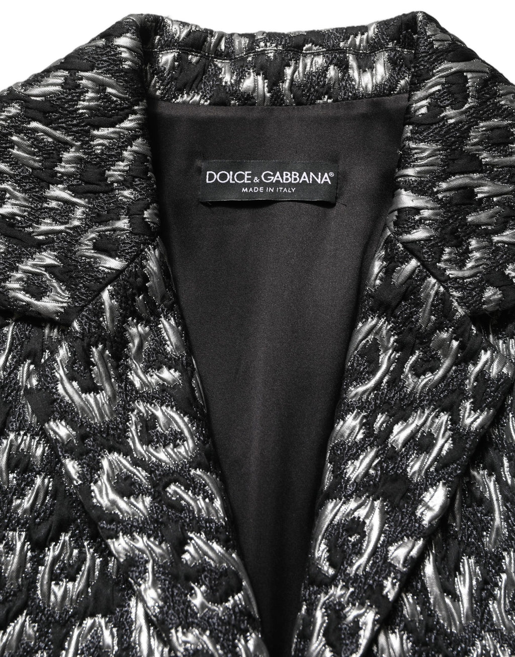Veste en jacquard noir et argent Dolce & Gabbana avec motif léopard, manteau chic en tissu élégant.