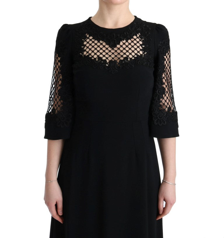 Robe longue noire Dolce & Gabbana, robe stretch droite, maxi élégante et fluide, vue de face sur un fond neutre.