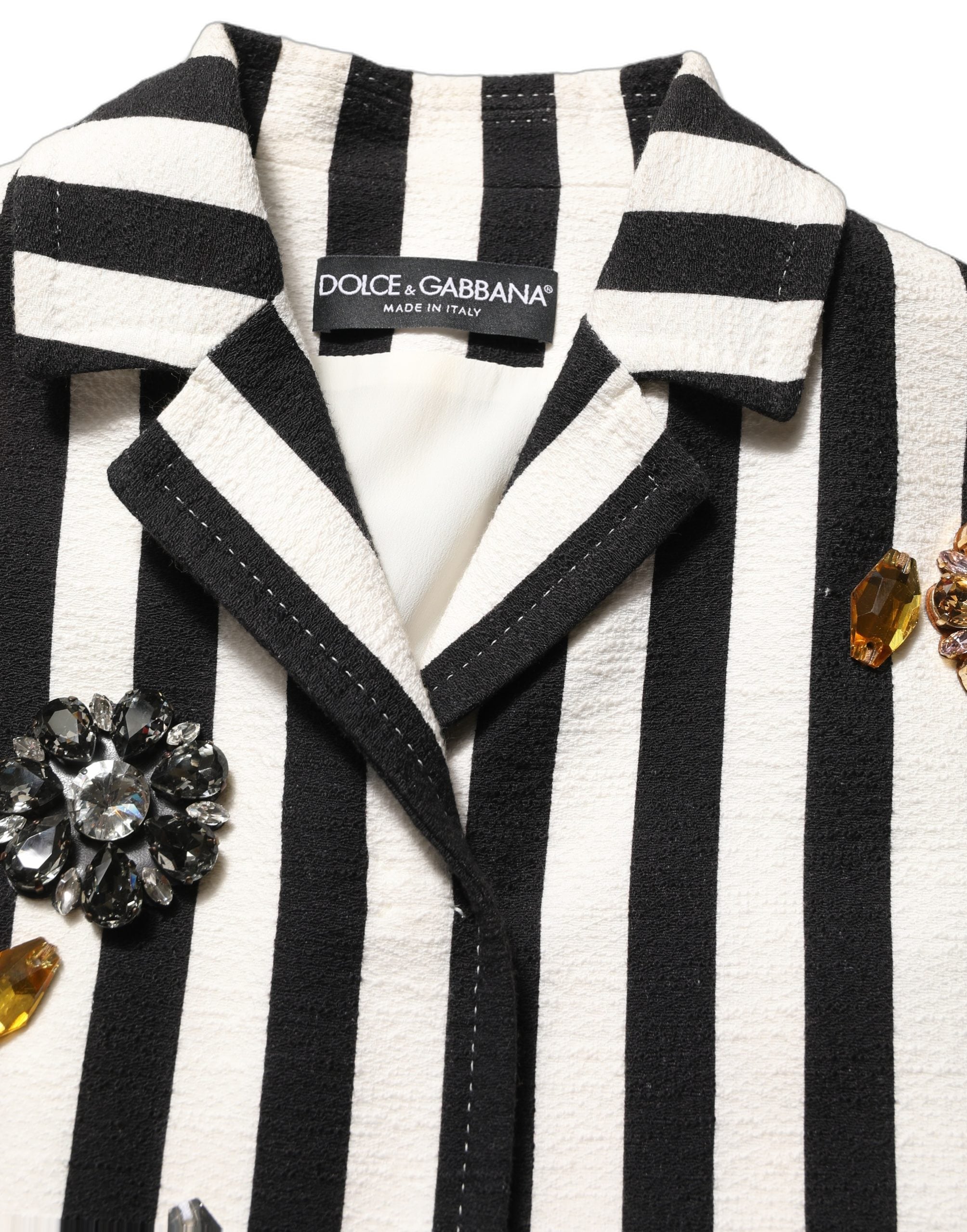 Manteau noir et blanc à rayures avec embellissements Dolce & Gabbana, veste élégante en tissu sophistiqué.