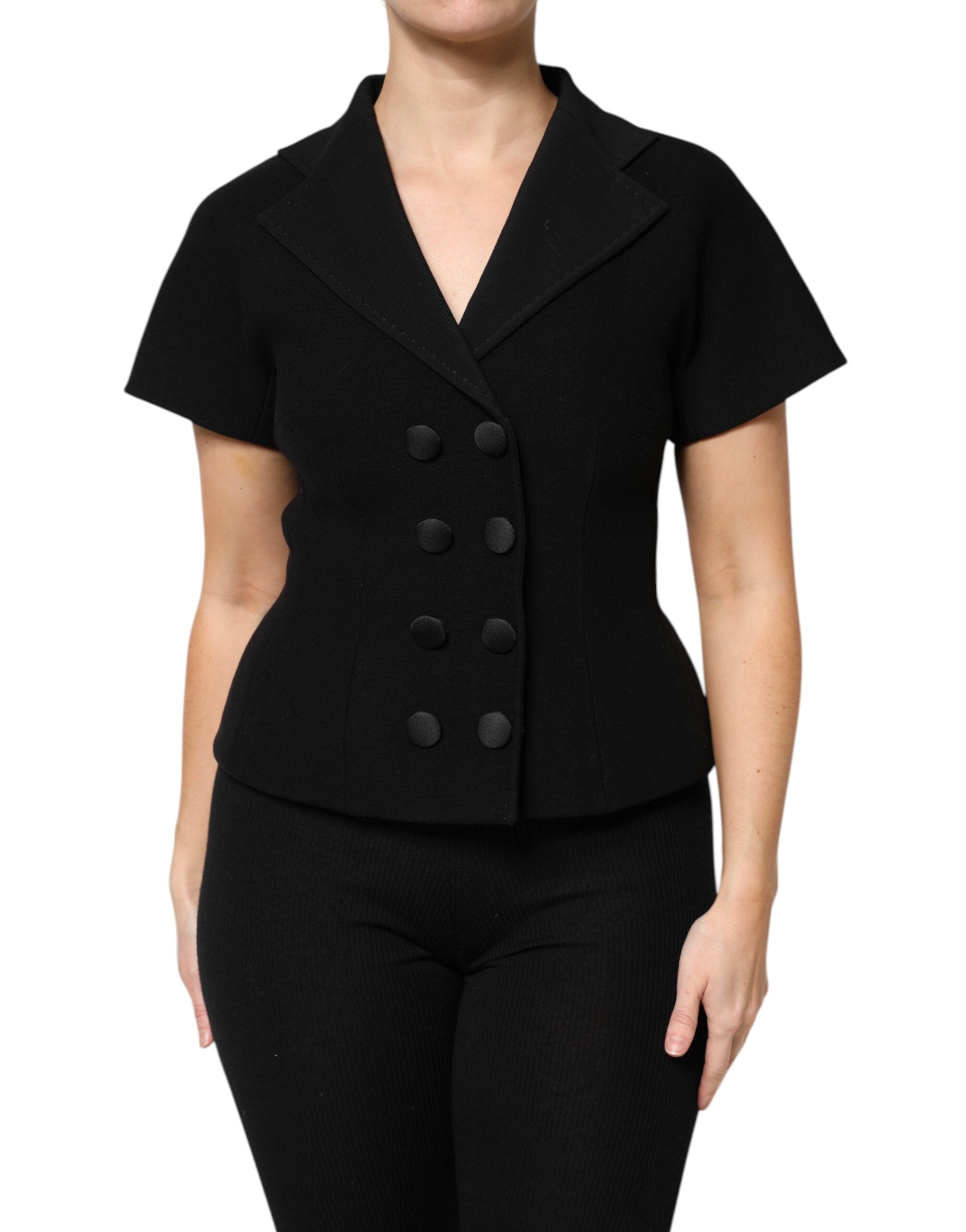 Manteau en laine noire Dolce & Gabbana à double boutonnage, élégant et chaud, avec col classique et coupe ajustée.