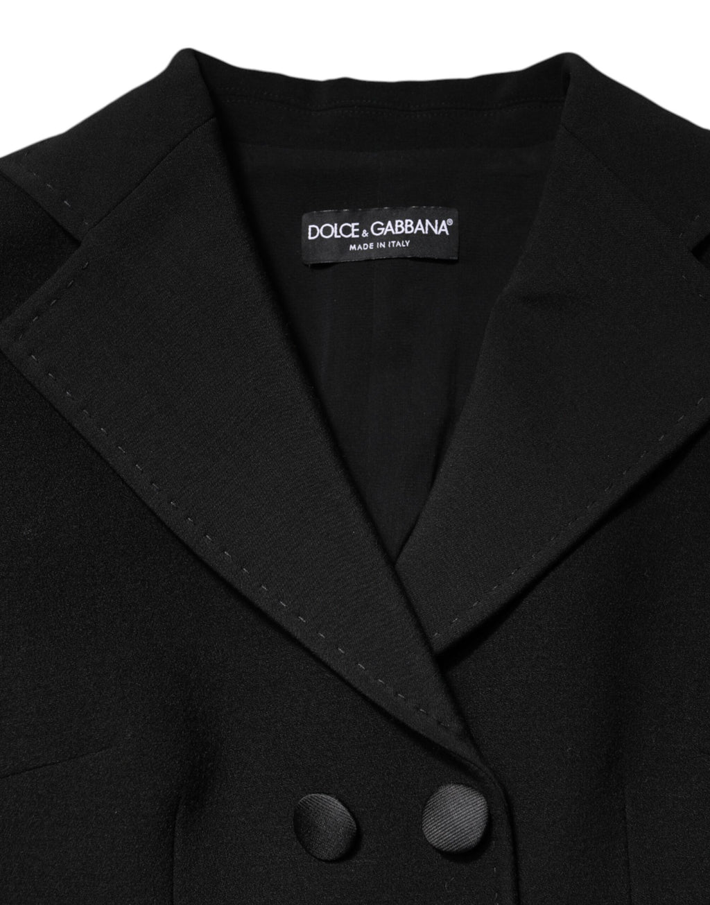 Manteau noir en laine Dolce & Gabbana, double boutonnage, veste élégante avec col large, vue de face sur un fond neutre.