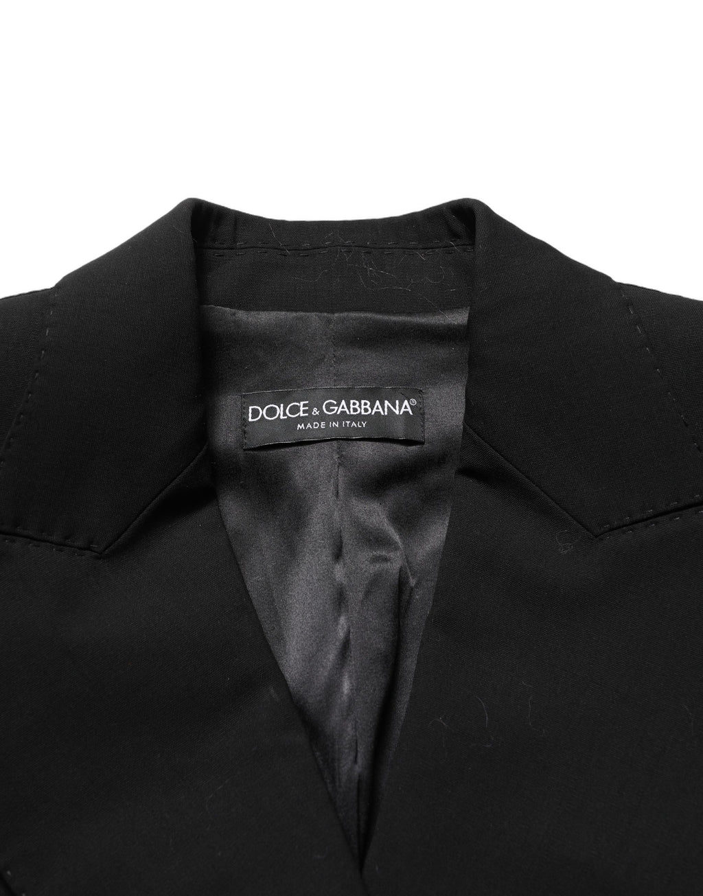 Veste en laine noire Dolce & Gabbana à double boutonnage avec manches en dentelle, élégante et sophistiquée.