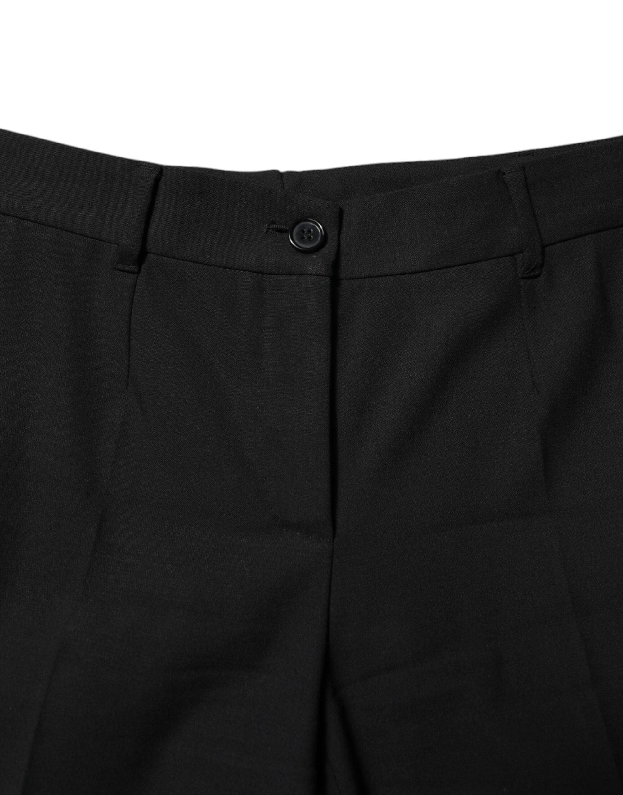 Pantalons en laine noire à taille haute et coupe tapered de Dolce & Gabbana, vue de face, détails de la texture en gros plan.