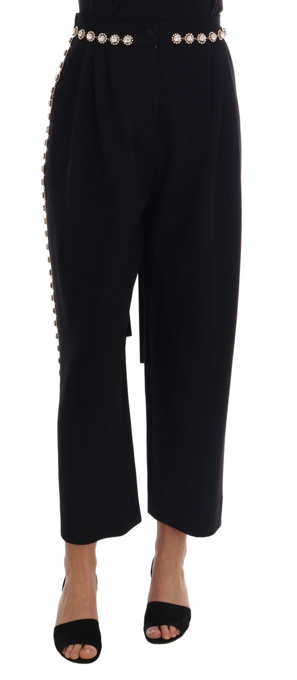 Pantalon noir en laine extensible avec cristaux de la marque Dolce & Gabbana, vue en gros plan sur le tissu et les détails.