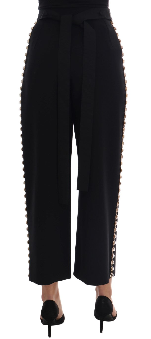 Pantalon noir en laine extensible Dolce & Gabbana avec cristaux, vue de face sur fond blanc.