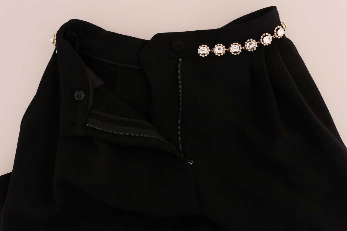 Pantalon noir en laine stretch avec cristaux de Dolce & Gabbana, coupe élégante et détails brillants visibles sur l'image.