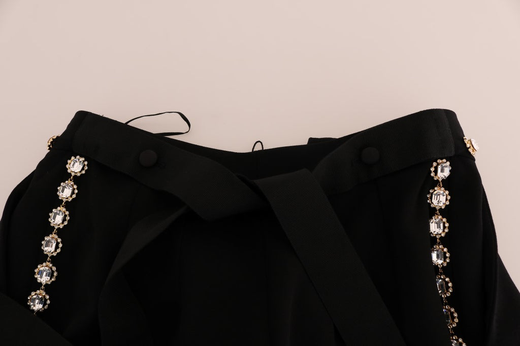 Pantalon noir en laine stretch avec cristaux de Dolce & Gabbana, coupe élégante et détails brillantés visibles sur l'image.