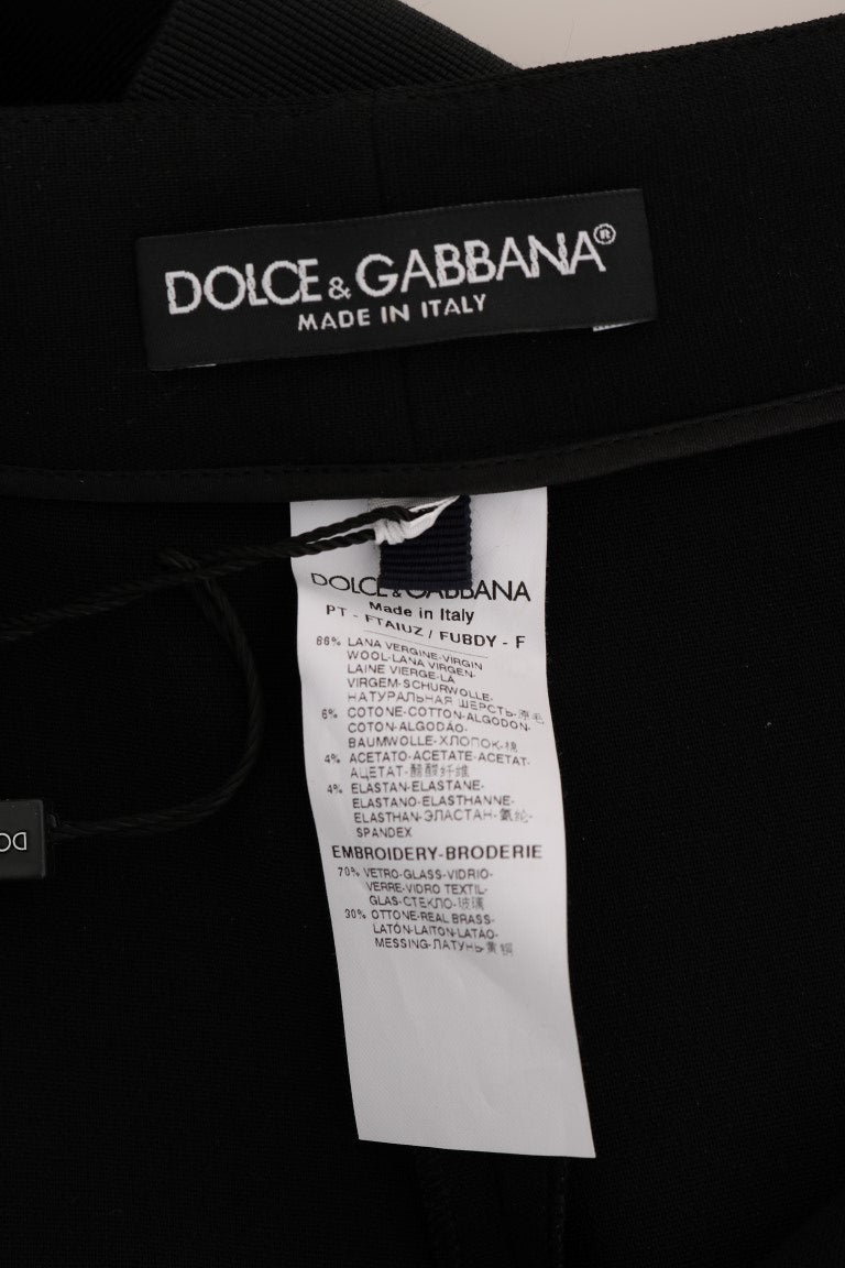 Pantalon en laine noire extensible avec cristaux de Dolce & Gabbana, coupe élégante et détails brillants visibles sur l'image.
