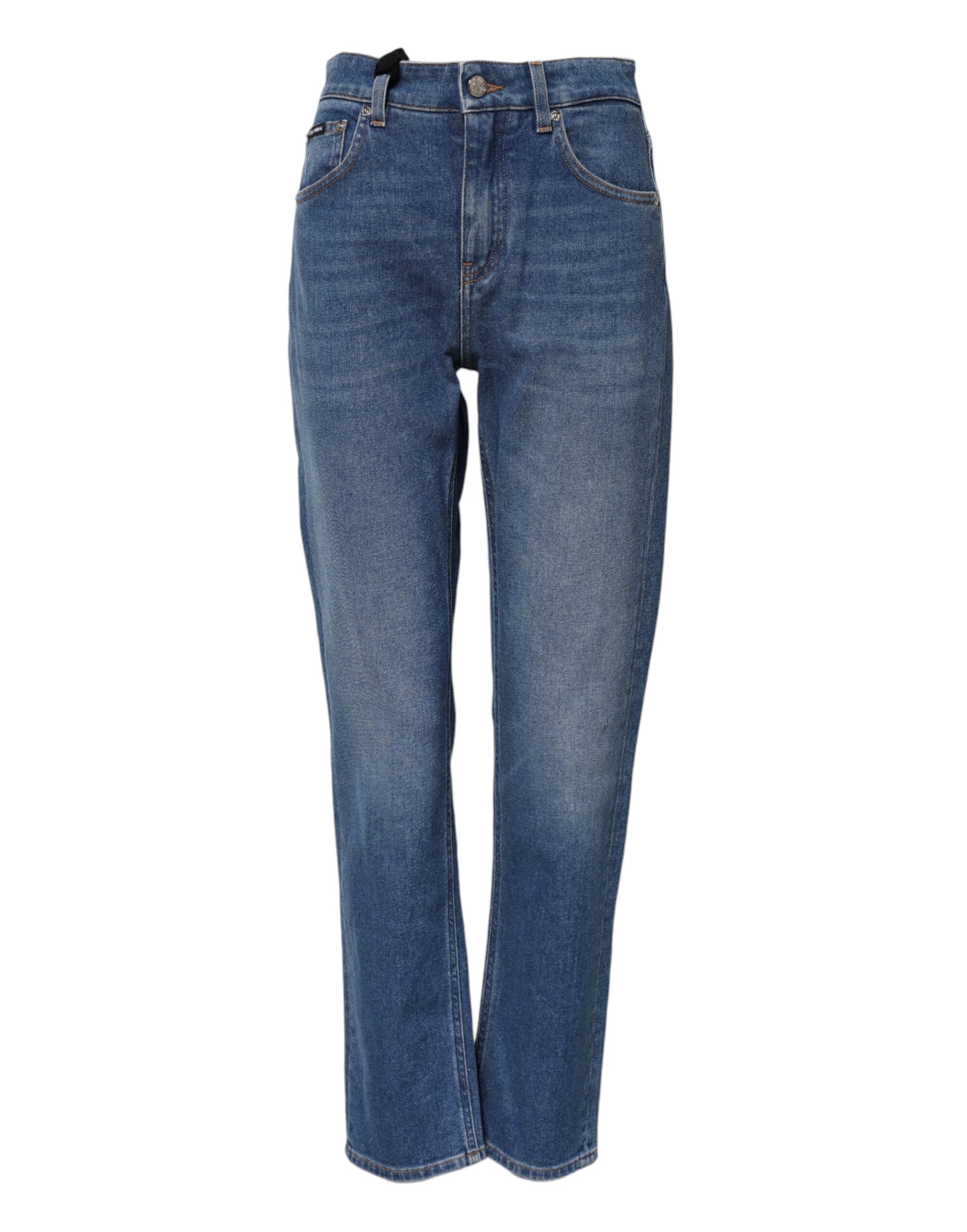 Jeans en denim bleu Dolce & Gabbana, taille haute, coupe tapered, en coton, visibles sur la photo.