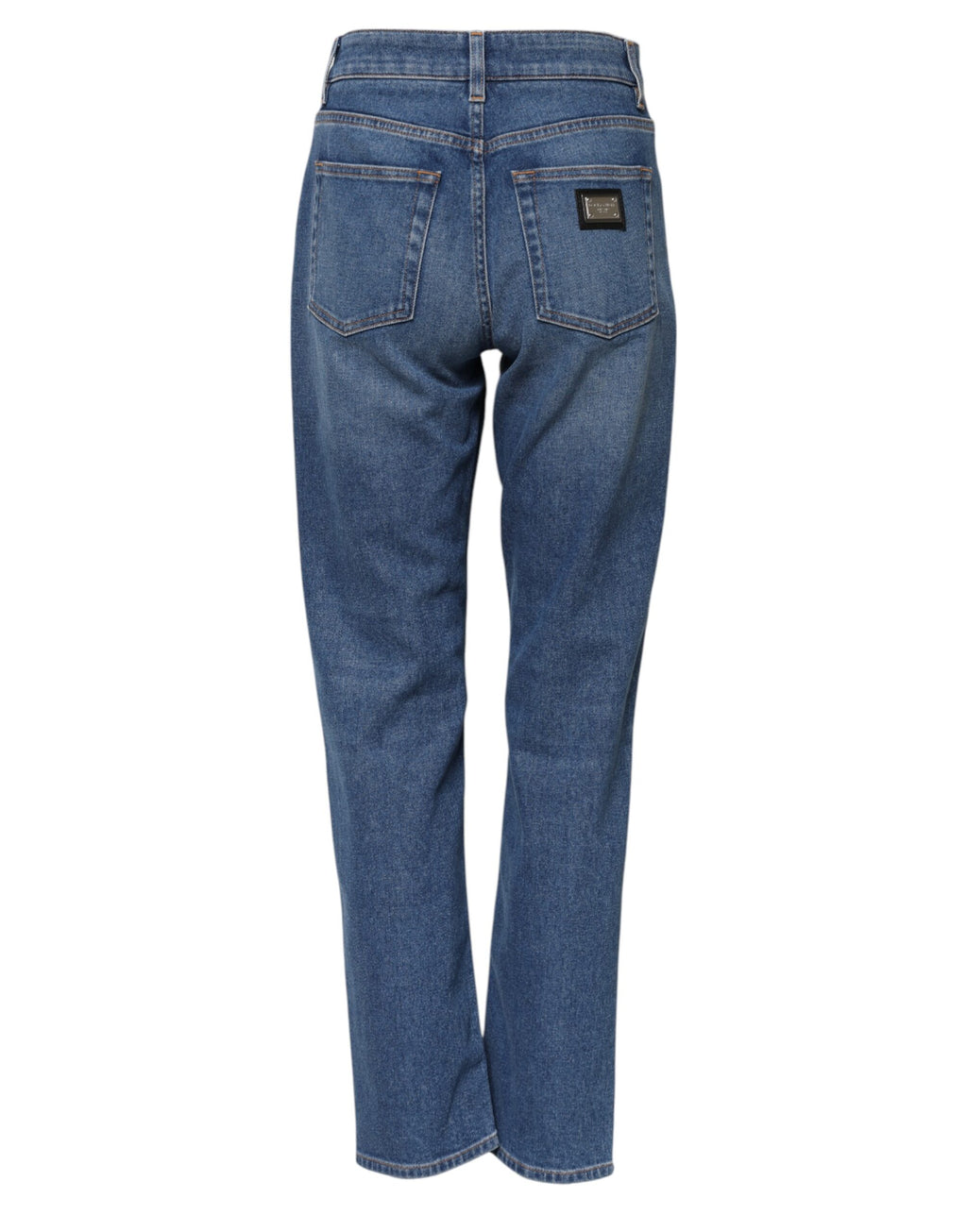 Jeans en denim bleu Dolce & Gabbana, taille haute et coupe tapered, visibles en détail sur la photo.