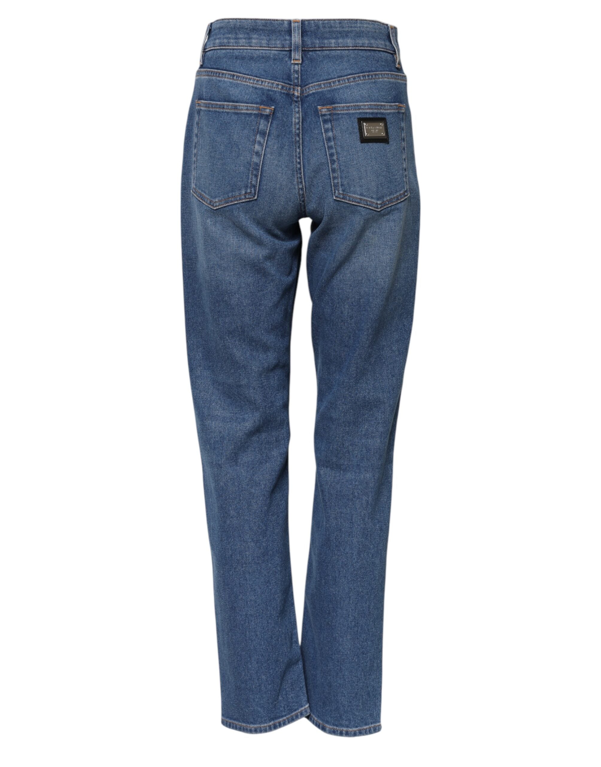 Jeans en denim bleu Dolce & Gabbana, taille haute et coupe tapered, visibles en détail sur la photo.