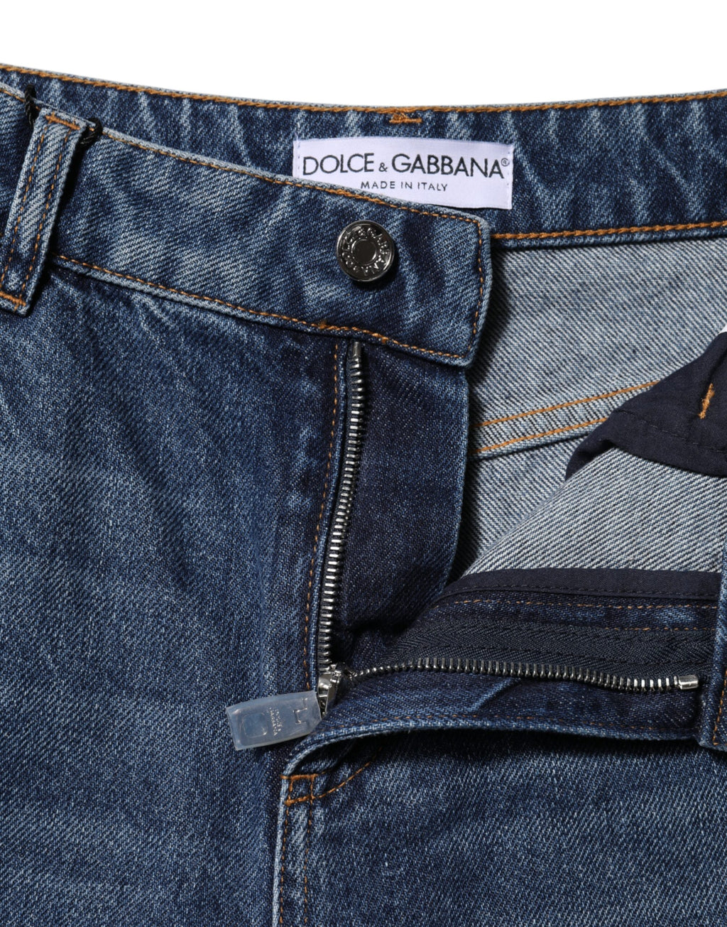 Jeans en denim large en coton bleu de Dolce & Gabbana avec ourlets déchirés et style décontracté.