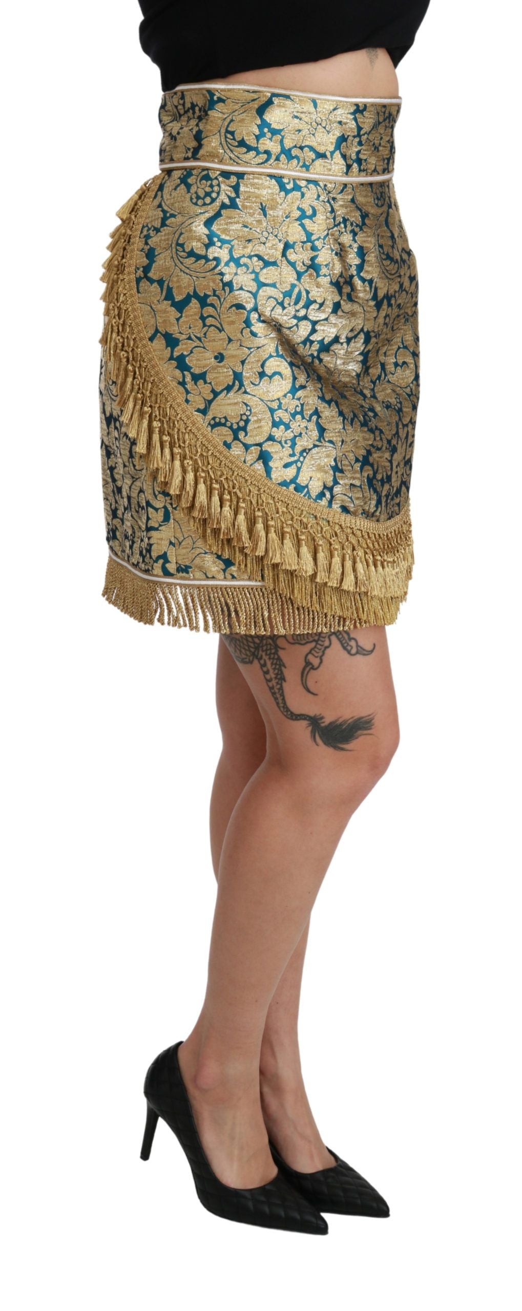 Jupe longue Dolce & Gabbana en jacquard bleu à taille haute avec franges dorées et détails élégants.