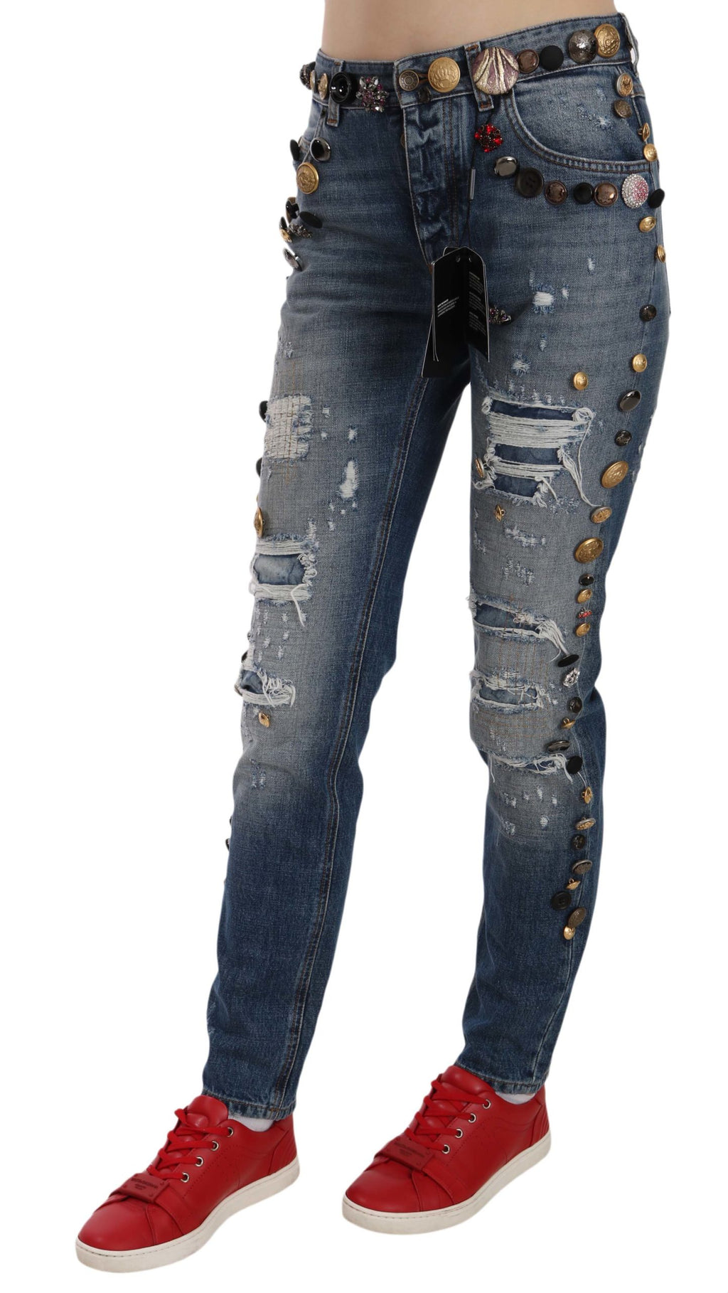 Jeans en denim Dolce & Gabbana avec boutons ornés et détails usés, style décontracté et tendance.