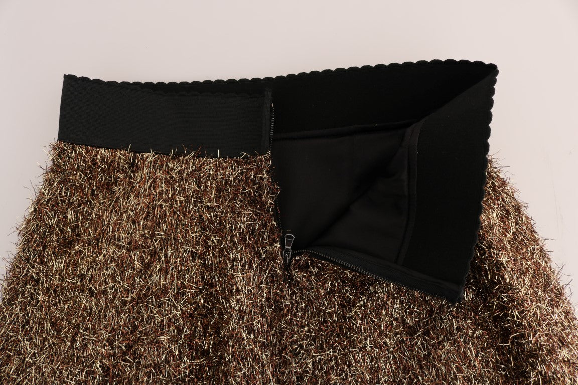 Mini jupe dorée et noire Dolce & Gabbana, coupe courte, style élégant et tendance, en tissu brillant.