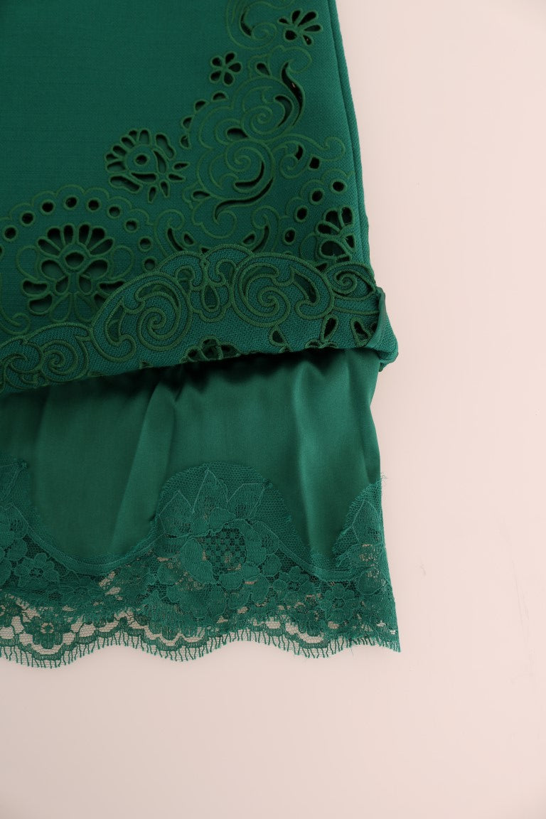 Robe en soie et laine verte à motifs floraux et découpes, signée Dolce & Gabbana, vue de face.
