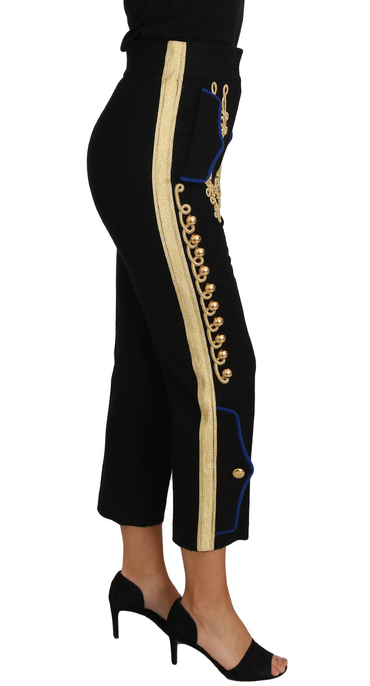 Pantalon habillé noir Dolce & Gabbana avec embellissements militaires dorés, style élégant et sophistiqué.