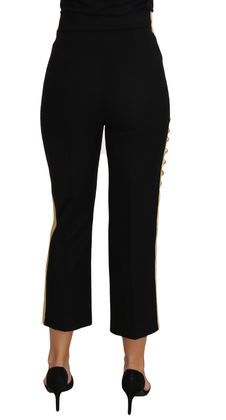 Pantalon Dolce & Gabbana militaire noir avec embellissements dorés, style élégant et détails sophistiqués.