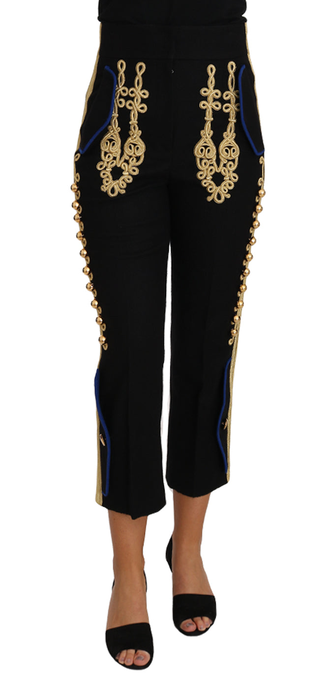 Pantalon de costume Dolce & Gabbana noir avec embellissements militaires dorés, style élégant et sophistiqué.
