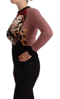 Pull en cachemire rose Dolce & Gabbana, col rond, pull-over élégant pour femme, texture douce et finition soignée.