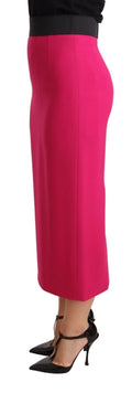 Jupe Dolce & Gabbana rose à taille haute, coupe pencil stretch droite, visible en détail sur l'image.