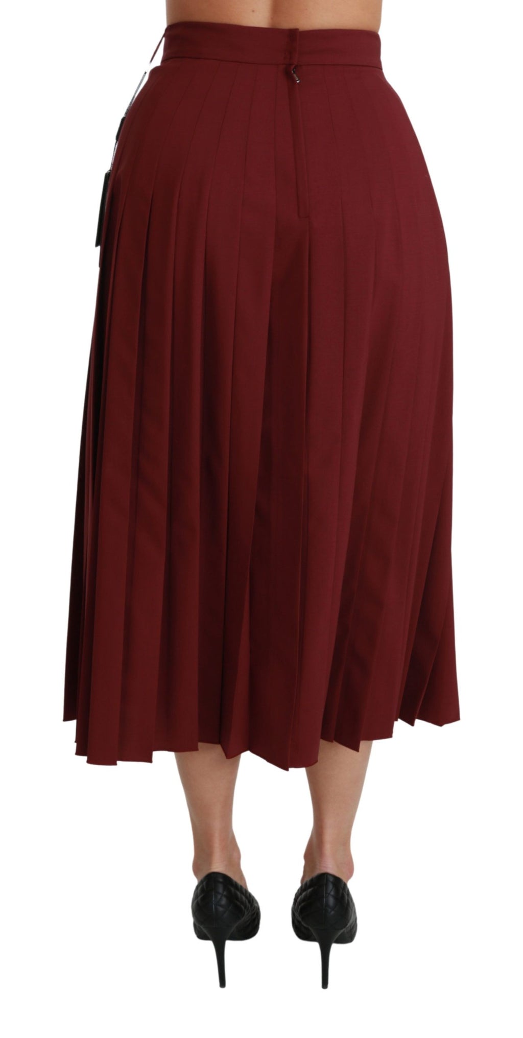 Jupe longue en laine rouge à taille haute et plissée de la marque Dolce & Gabbana, vue de face.
