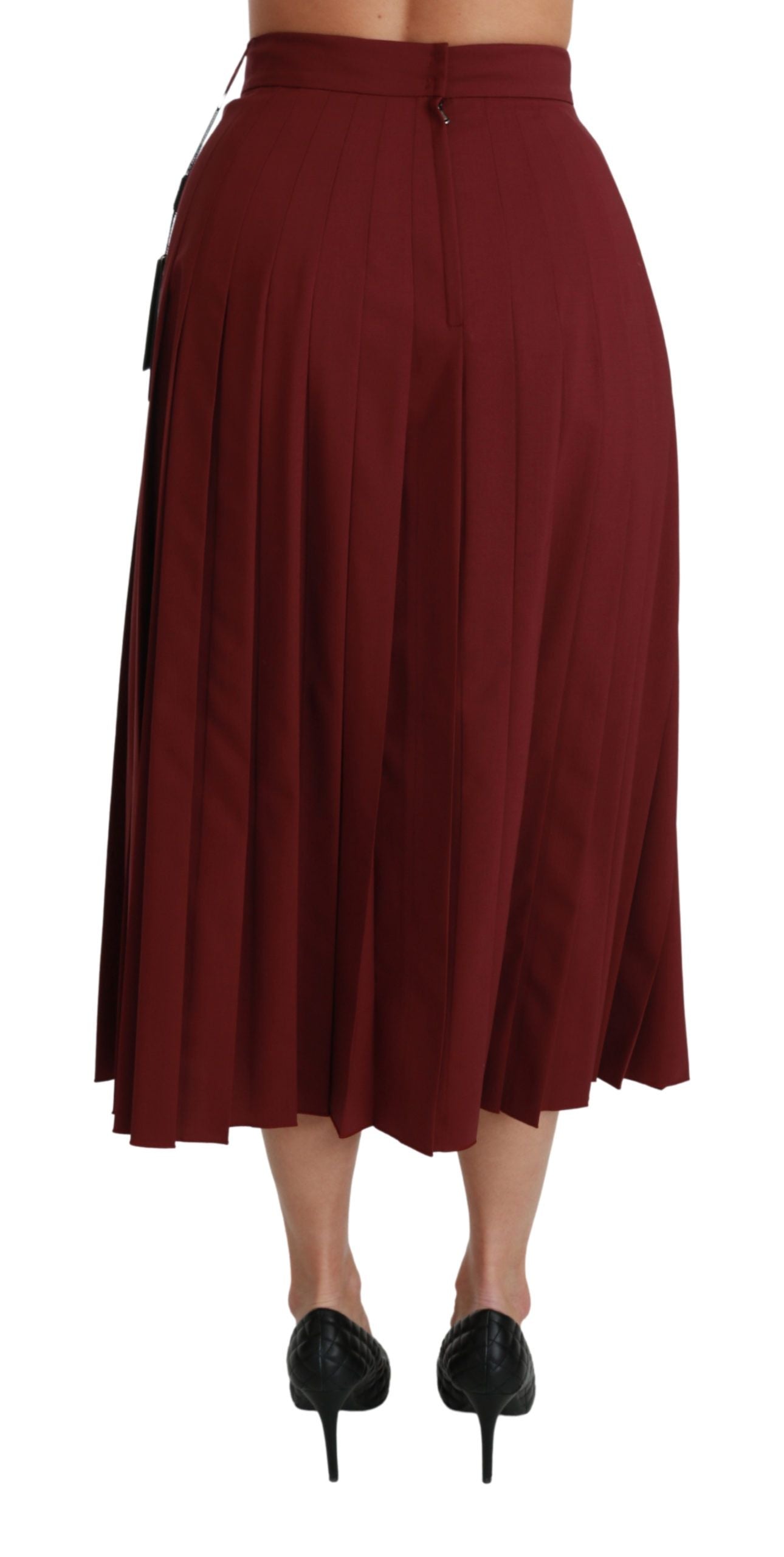Jupe longue en laine rouge à taille haute et plissée de la marque Dolce & Gabbana, vue de face.