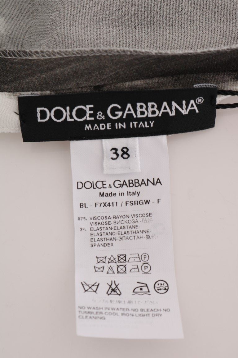 Chemisier Dolce & Gabbana à rayures blanches et noires, imprimé, avec col et manches longues, vue de face.