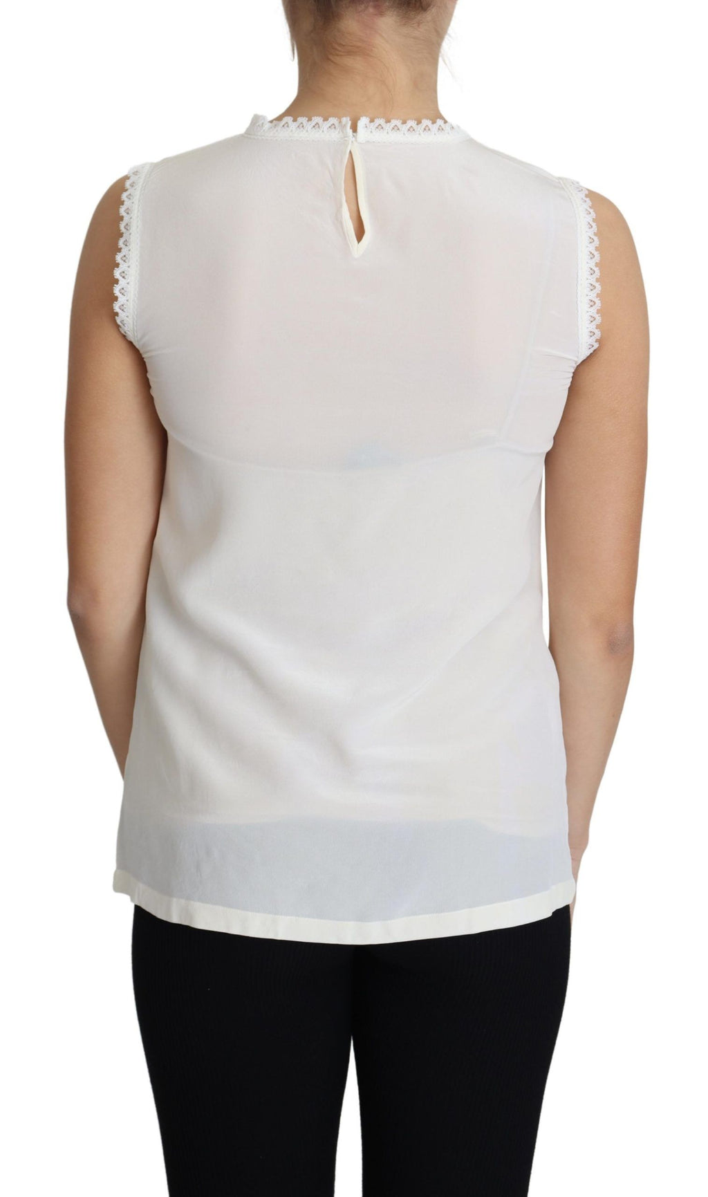 Blouse blanche en soie avec broderie en dentelle de Dolce & Gabbana, top sans manches élégant et féminin.