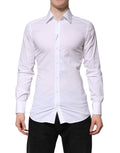 Chemise formelle blanche en coton Dolce & Gabbana à manches longues avec détails dorés, vue de face sur mannequin.