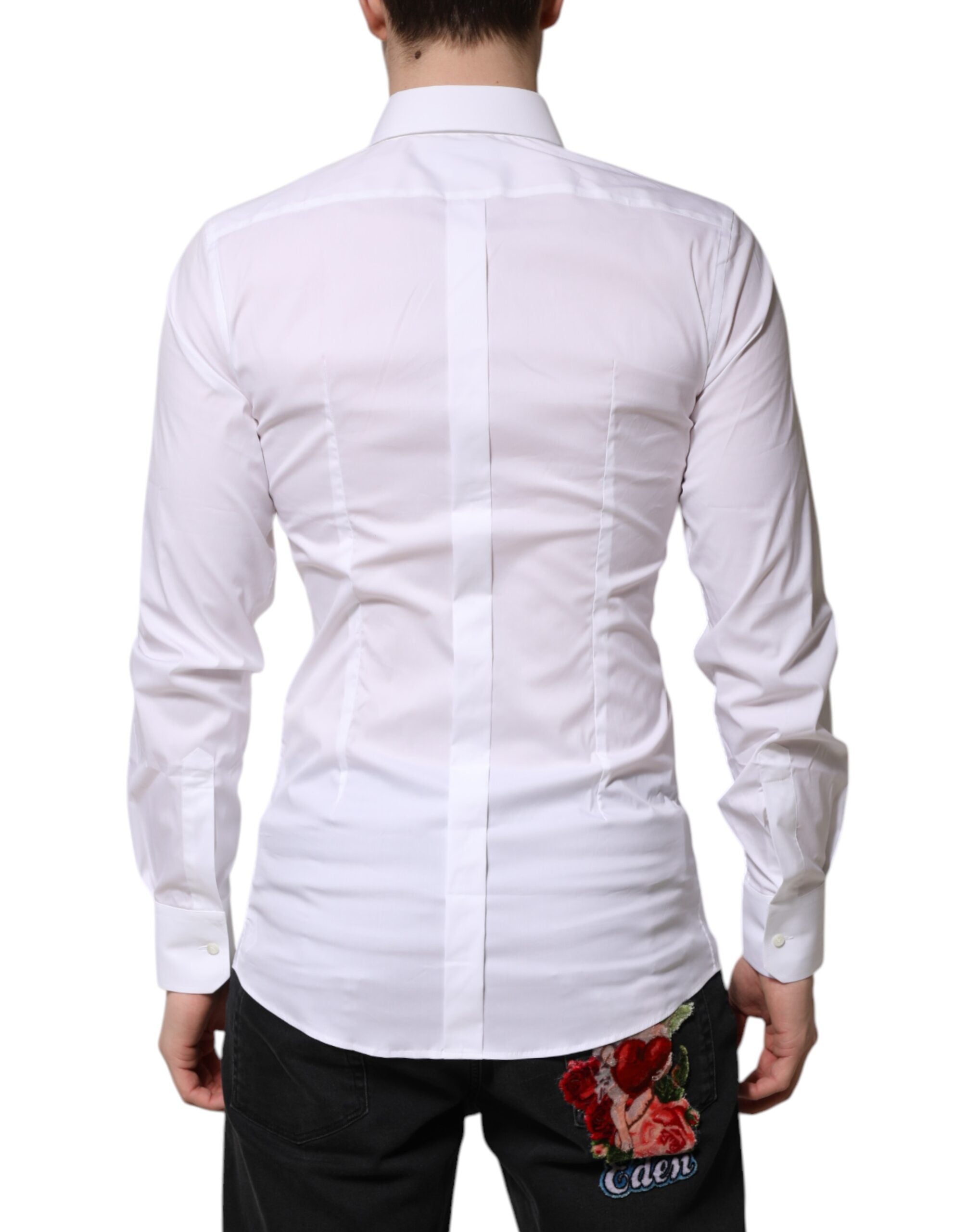 Chemise blanche en coton Dolce & Gabbana à manches longues, élégante et formelle, avec détails dorés visibles sur l'image.