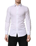 Chemise homme Dolce & Gabbana en coton blanc à manches longues, style formel avec détails dorés.