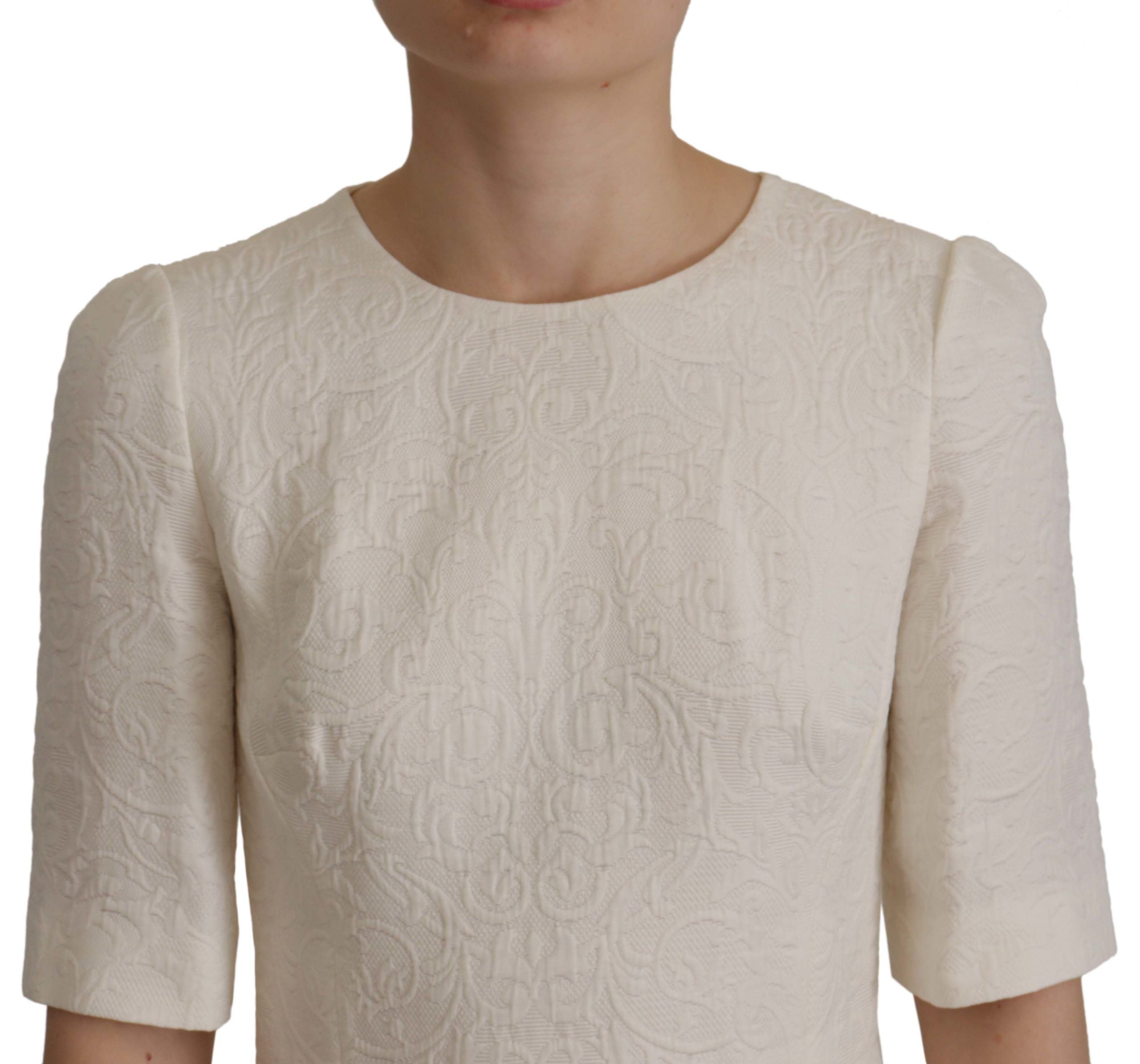 Robe midi en jacquard floral blanc de Dolce & Gabbana, coupe ajustée et élégante, en tissu brocart sophistiqué.