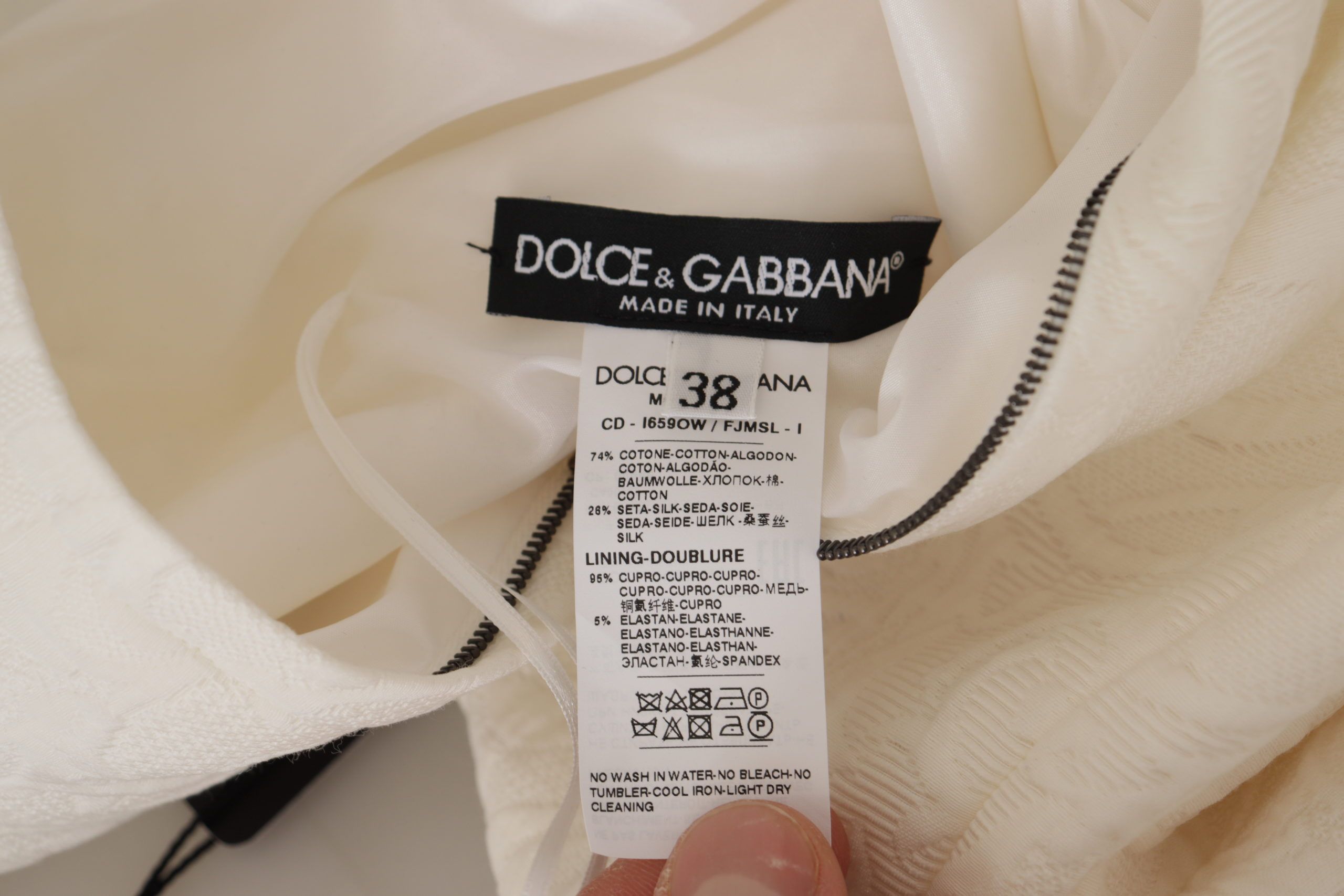 Robe trapèze en jacquard blanc avec motifs floraux pour femme, design élégant de la marque Dolce & Gabbana.