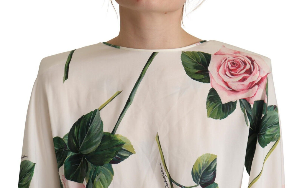 Robe longue Dolce & Gabbana à manches longues avec motif de roses blanches et coupe en A, vue de face.