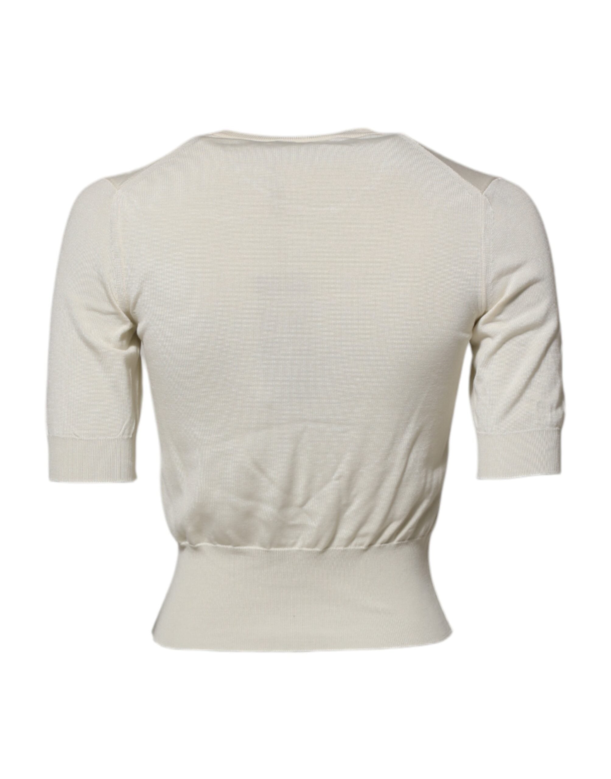 Chemise en soie blanche Dolce & Gabbana à manches courtes, élégante et légère, vue de face sur fond neutre.