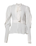 Haut blanc en viscose avec col ascot et manches longues de Dolce & Gabbana, élégance sophistiquée.