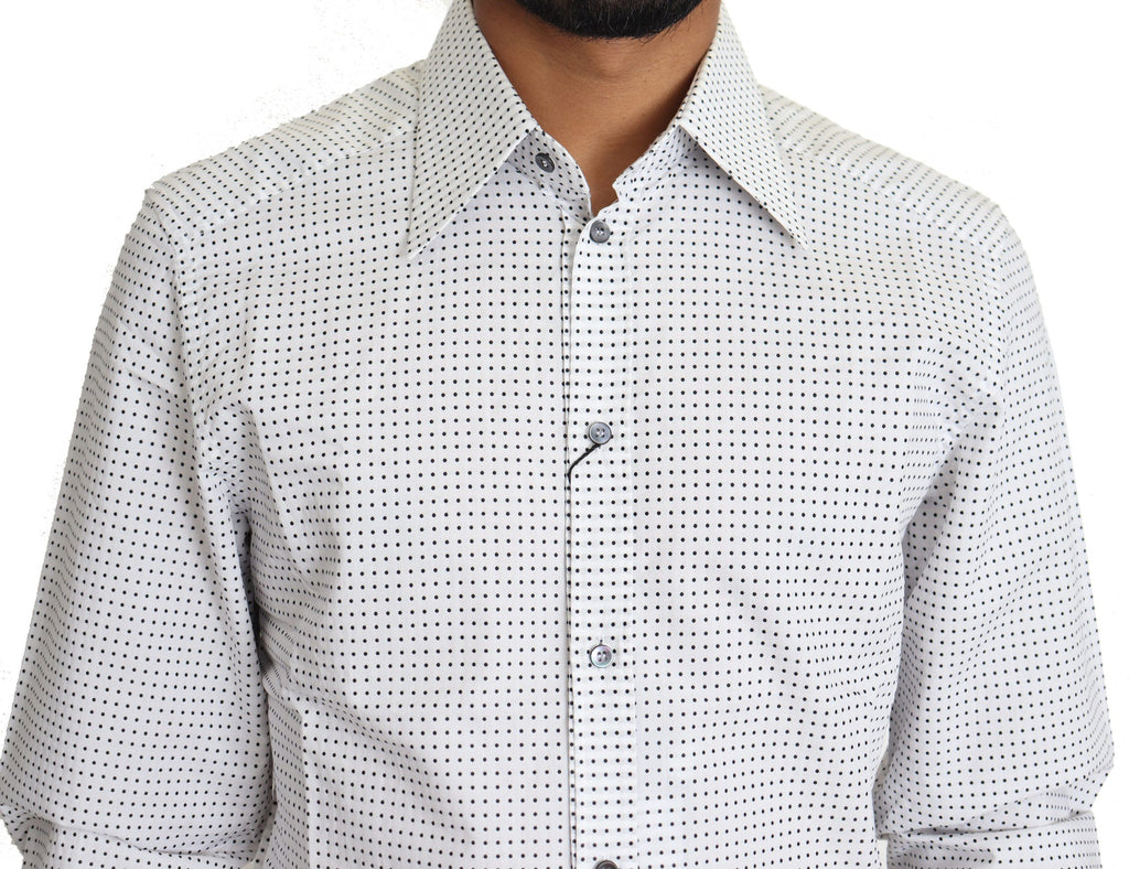 Chemise Dolce & Gabbana à pois noirs et blancs, élégante, en coton, avec col classique et manches longues.