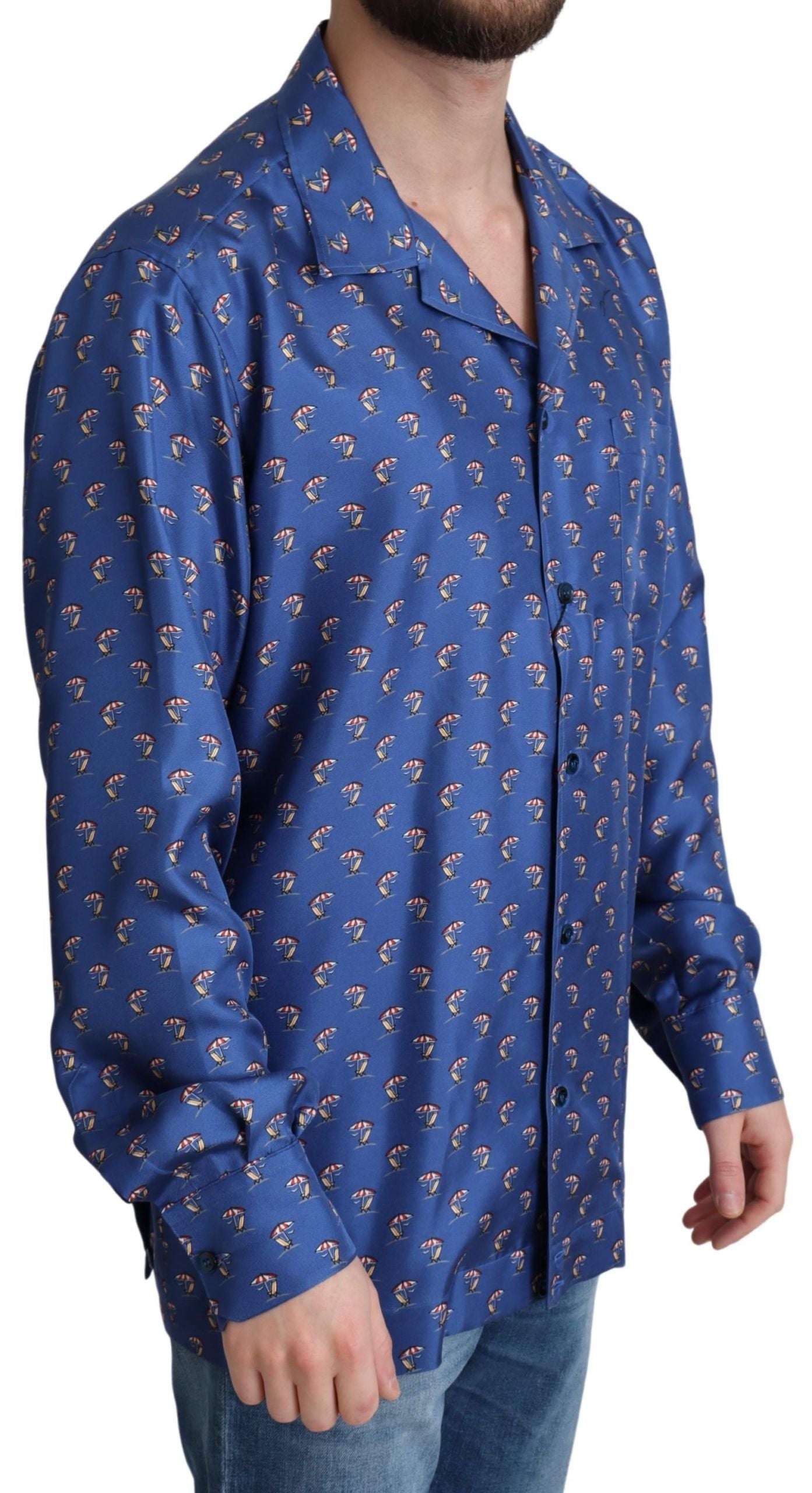 Chemise en soie Dolce & Gabbana à imprimé parasol et plage bleus, style élégant et sophistiqué pour l'été.