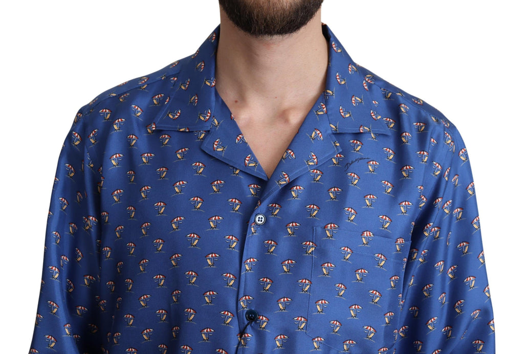 Chemise en soie à imprimé parasol plage bleu Dolce & Gabbana, style élégant avec motif coloré.