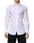 Chemise blanche Dolce & Gabbana à manches longues pour homme, vêtement formel élégant avec détails dorés visibles sur l'image.