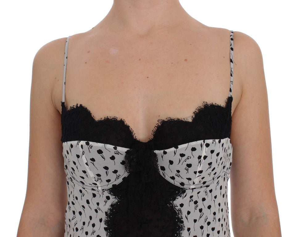 Lingerie babydoll en soie noire avec dentelle, top Dolce & Gabbana, élégant et féminin, visible en détail dans l’image.