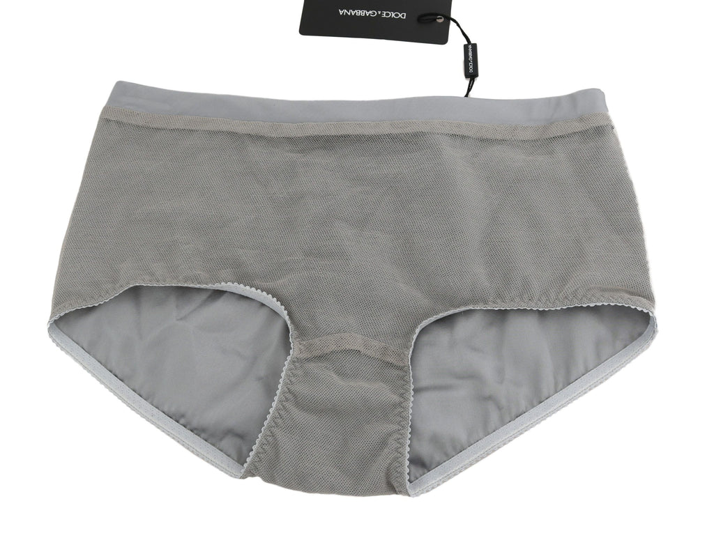 Sous-vêtements Dolce & Gabbana en argent avec bas en filet en soie, détails élégants et tissu léger visible dans l'image.