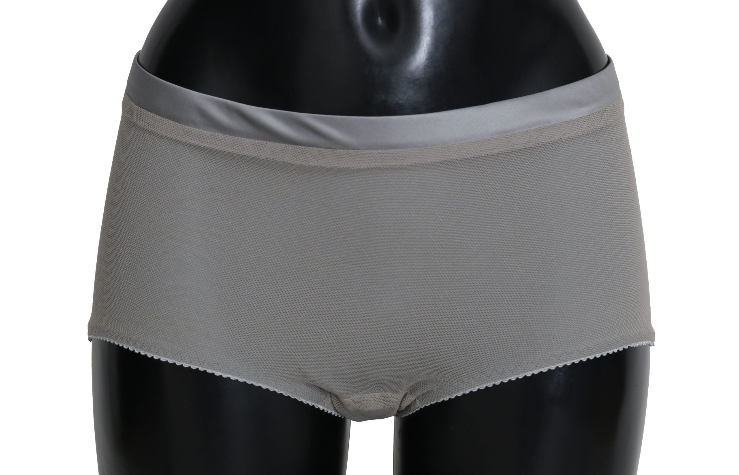 Sous-vêtements Dolce & Gabbana en argent avec bas en soie et filet, détails élégants et sophistiqués visibles sur l'image.