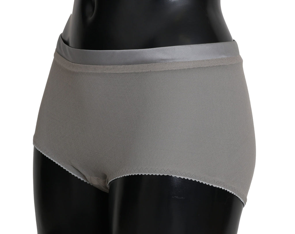 Sous-vêtements Dolce & Gabbana en argent avec bas en filet en soie, détail élégant et matière délicate visible dans l'image.