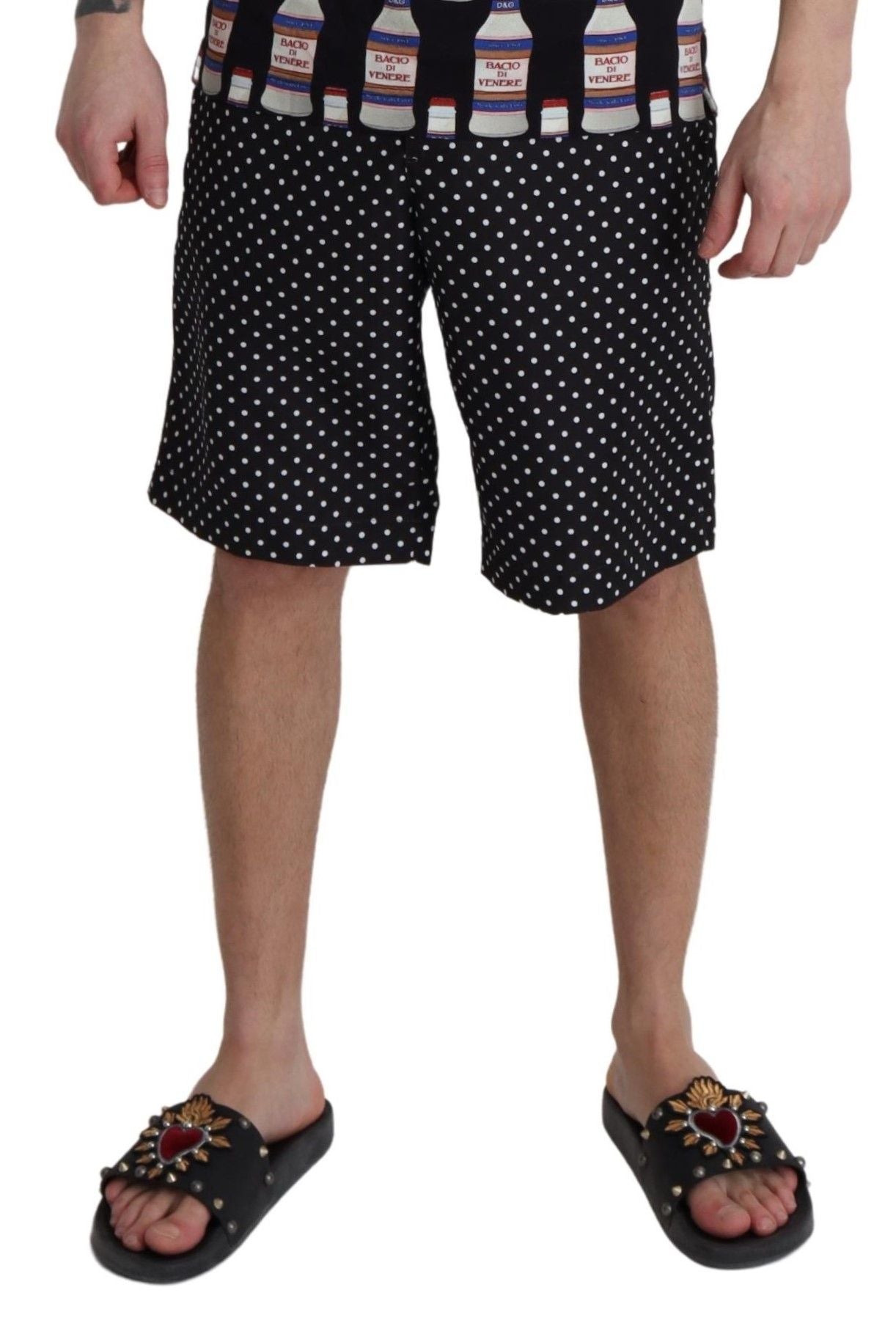 Shorts de bain noirs à pois Dolce & Gabbana, maillot de bain plage élégante pour femmes, détails en tissu léger.