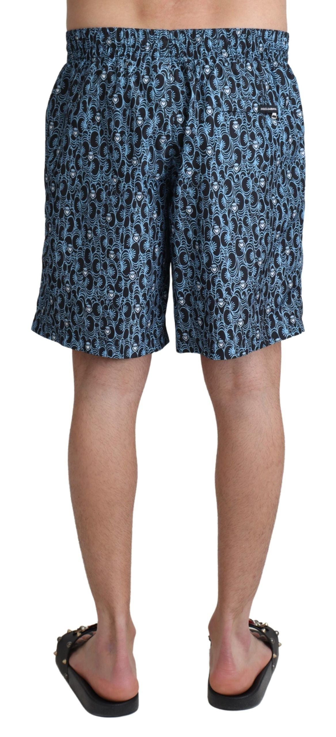 Shorts de bain Dolce & Gabbana à motif bleu pour plage, maillot de bain léger et coloré, en tissu fluide.